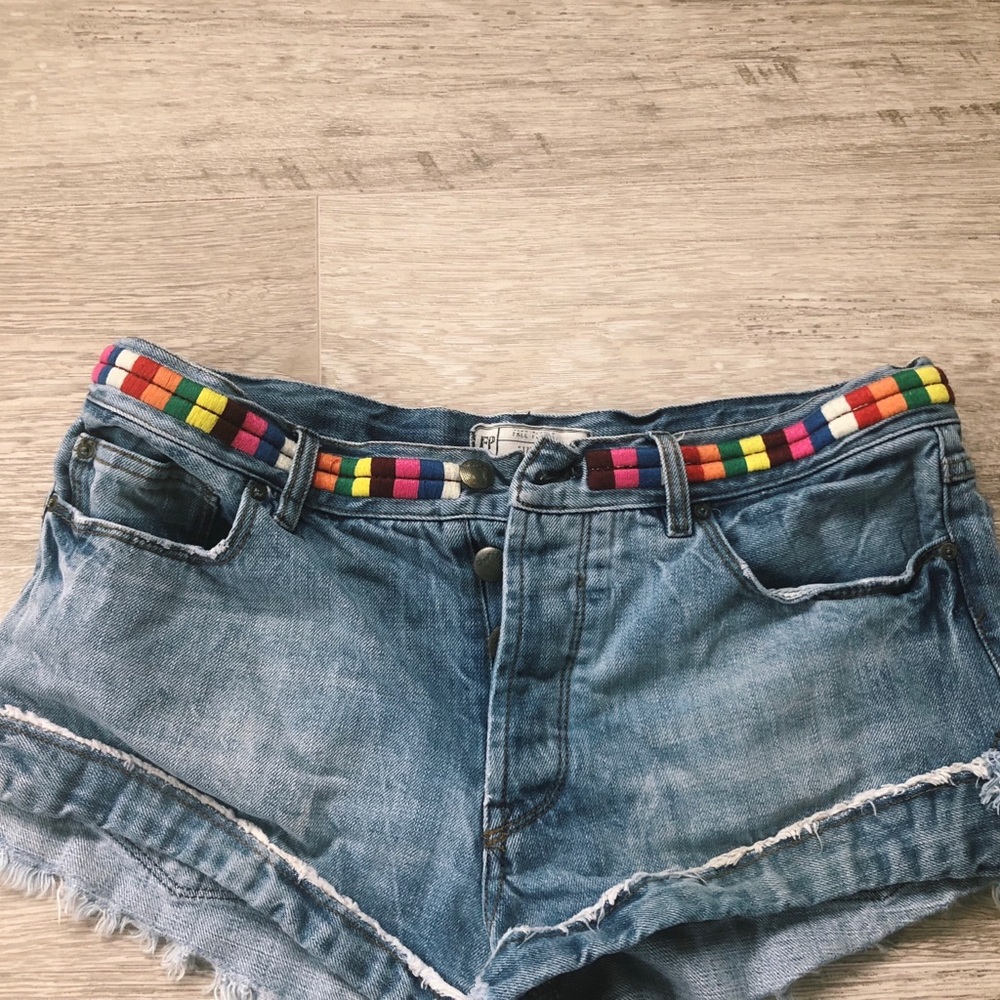 Free people jean cut offs with rainbow embroidery